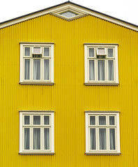 Yellow facade of a house in Iceland. Street shot in Reykjavik. 
