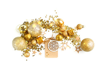 New year and Christmas holiday concept. Golden Christmas balls and paper tag on white background. Christmas Golden decor, template for design. copy space. top view
