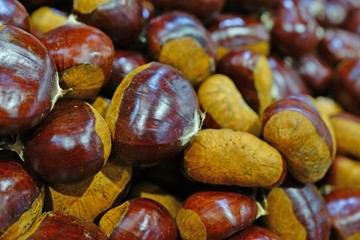 Fresh chestnuts in the shell at a farmers market