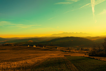 Yellow sunset over autumn field