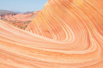 Large wave of striated sandstone in Arizona canyon.