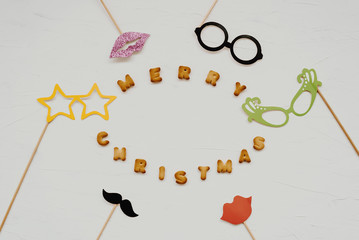 The words merry christmas and happy new year are written from cookie letters. Flat lay composition...