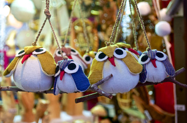 Christmas toys owls sitting on a branch on the Christmas tree