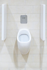 Close-up of toilet bowl. White toilet in the bathroom. Public toilet in the airport or restaurant, cafe.           