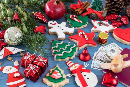 Christmas cookies and gifts with preparation with passport and money for holiday