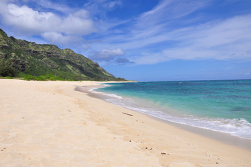 Fototapeta na wymiar White sandy beach at Mokuleia Beach Park, Kaena Point at the North Shore on Oahu Island, Hawaii, United States.