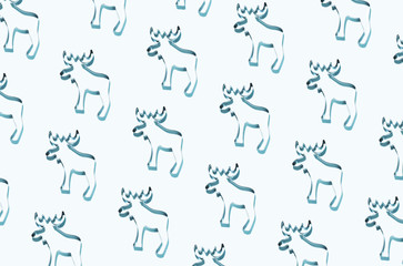 Pattern made of silver reindeers on blue background. Christmas and New Year concept.
