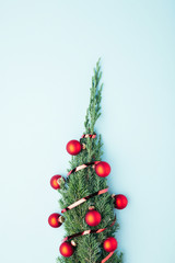 Concept of Christmas tree on blue background. New Year greeting card.