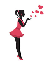 Silhouette of a graceful woman in a pink dress sends an air kiss with hearts