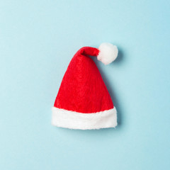 Santa Claus's hat on blue background. Minimal styled card.