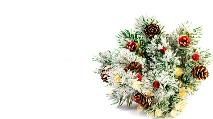 Obraz na płótnie Canvas Christmas and New Year card with little New Year Tree, branches of fir tree, baubles on the white background with space for text. Holidays concept.