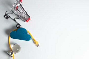 shopping cart with lan wire in buy product online network concept, digital technology cloud storage
