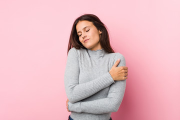 Obraz premium Young cute woman hugs, smiling carefree and happy.