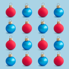 Christmas background from navy blue and red Christmas balls in the form of a pattern on a blue background