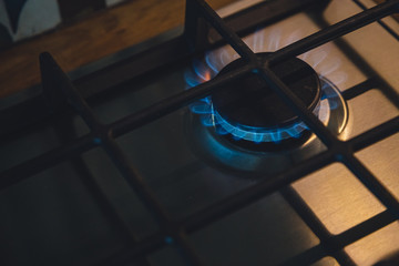 close-up of a gas burner on a stove in the kitchen