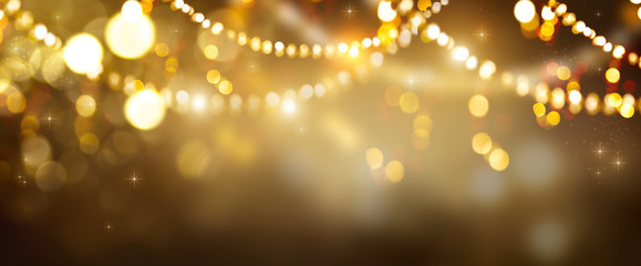 Christmas Gold glowing Background. Golden Holiday Abstract Glitter Defocused Backdrop With Blinking...