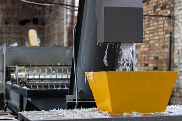 The machine washes and cuts the plastic film for recycling