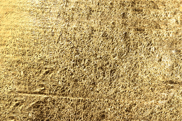 Abstract light Golden yellow background of crumpled aluminum foil. Can be used for design as a background.Golden texture