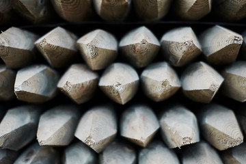 Packaged lumber in a trading port. Wooden cargo on the pier.