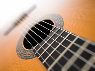 Acoustic guitar close up. Abstract background with the blur