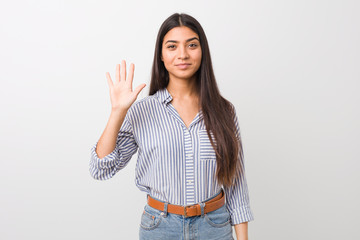 Young pretty arab woman smiling cheerful showing number five with fingers.