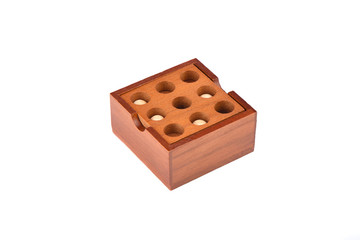 Wooden puzzle isolated on a white background. Puzzle balls and holes.