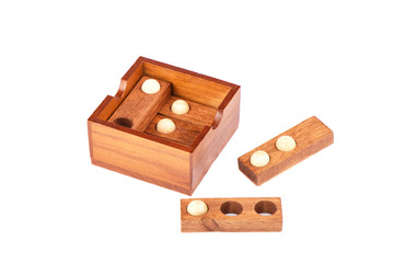 Wooden puzzle isolated on a white background. Puzzle balls and holes.