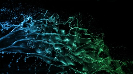colourful isolated liquid water splash in green and blue light on black background forming a beautiful floating silhouette of water