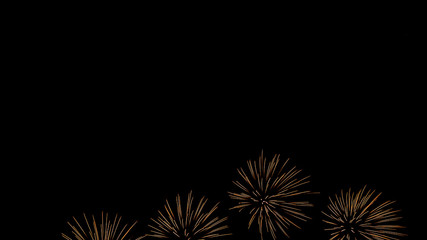Fototapeta premium A beautiful Fireworks light up the sky with dazzling display on dark background.