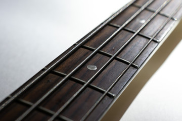 detail of an electric bass guitar with strings close up