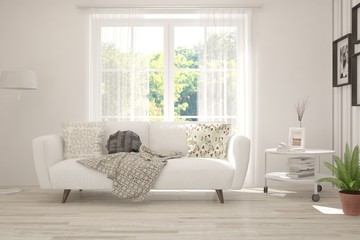 Stylish room in white color with sofa and summer landscape in window. Scandinavian interior design. 3D illustration