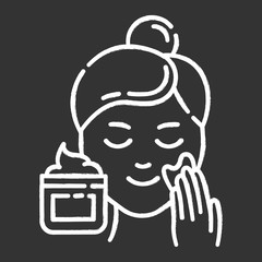 Applying cream chalk icon. Skin care procedure. Facial beauty treatment. Face product for lifting and exfoliating effect. Dermatology, cosmetics, makeup. Isolated vector chalkboard illustration