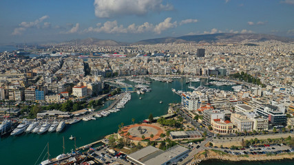 Naklejka premium Aerial drone photo of iconic round port of Marina Zeas or Pasalimani with boats, yachts and sail boats docked, port of Pireas , Attica, Greece