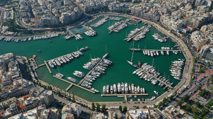 Aerial drone top down photo of yachts and sailboats docked in iconic round harbour of Zea or...