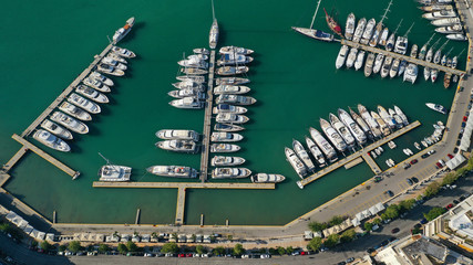 Aerial drone top down photo of yachts and sailboats docked in iconic round harbour of Zea or Passalimani, Piraeus, Attica, Greece