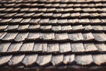 Old wooden tile on the roof of an old house