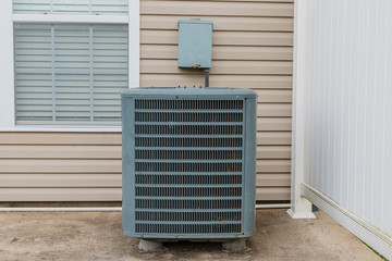 Old Air Conditioning Unit On Condo Patio