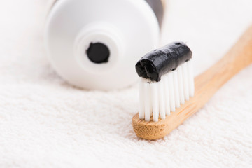 Toothbrush with black charcoal toothpaste
