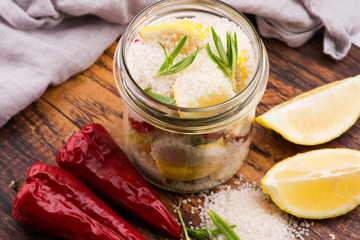 Preserved Lemons with salt on a wooden board
