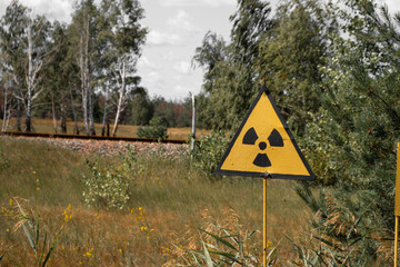 Warning danger radiation sign near the Red forest in Chernobyl exclusion zone