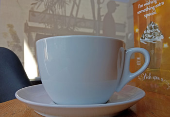white coffee mug empty on the wooden table