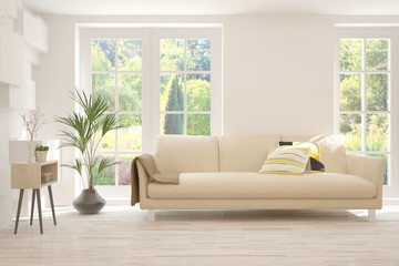 Stylish room in white color with sofa and summer landscape in window. Scandinavian interior design. 3D illustration