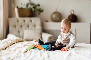 little child plays alone in his room