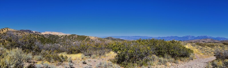 Views of Wasatch Front Rocky Mountains from the Oquirrh Mountains with fall leaves, Hiking in Yellow Fork trail and Rose Canyon in Great Salt Lake Valley. Utah, United States.