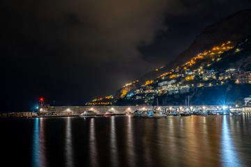 Fototapeta na wymiar Night view of Amalfi cityscape on coast of mediterranean sea, Italy.
