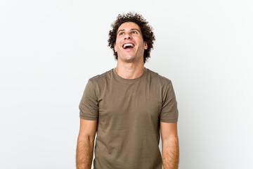 Mature handsome man isolated relaxed and happy laughing, neck stretched showing teeth.