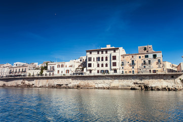 Cityscape of ancient buildings in seafront of Ortygia. Syracuse. Italy