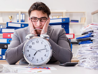 Businessman missing deadlines due to excessive work