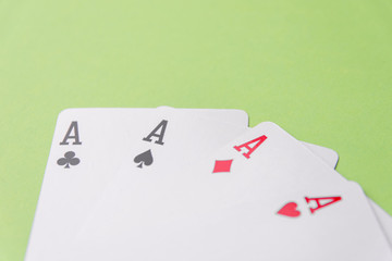 Four aces on green background. Concept of gambling risk
