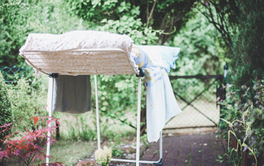 Laundry hung on the dryer outside in warm weather. The concept of cleaning, doing laundry.